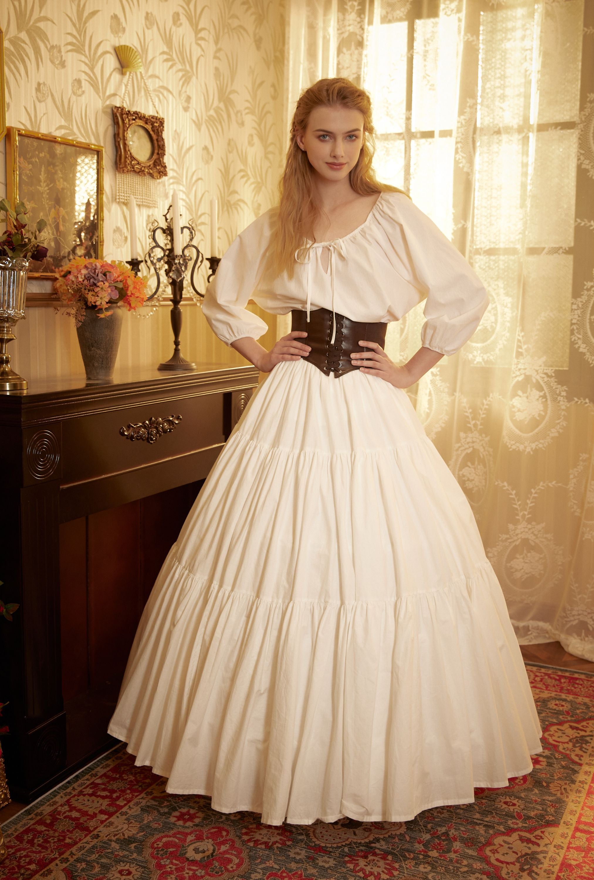 Close-up showing how the 4-hoop cotton underskirt creates a dramatic A-line silhouette and holds the shape of a long white dress.