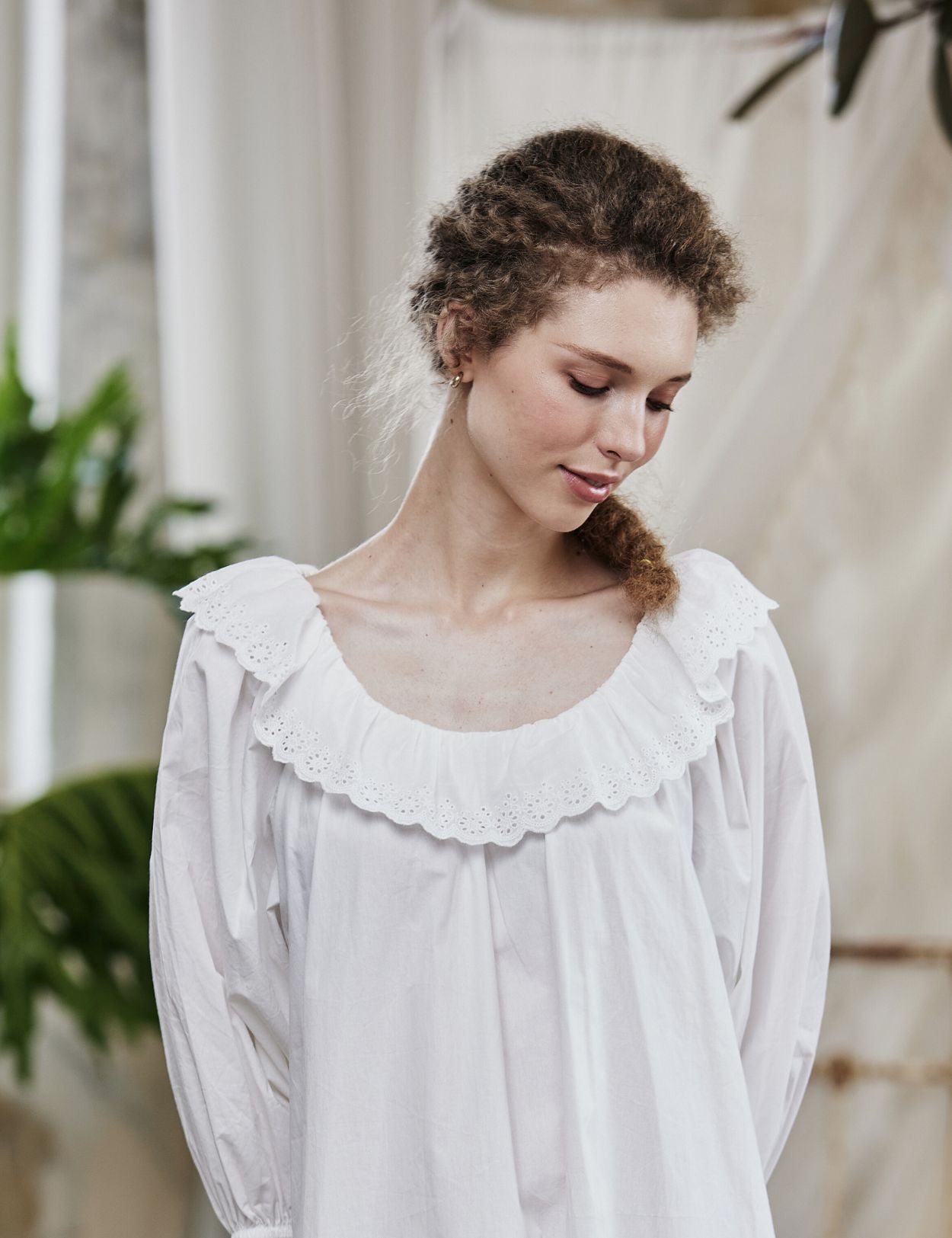 Close-up of an elegant 100% cotton Victorian peasant nightgown, showcasing the vintage-style neckline detail and lace trim.