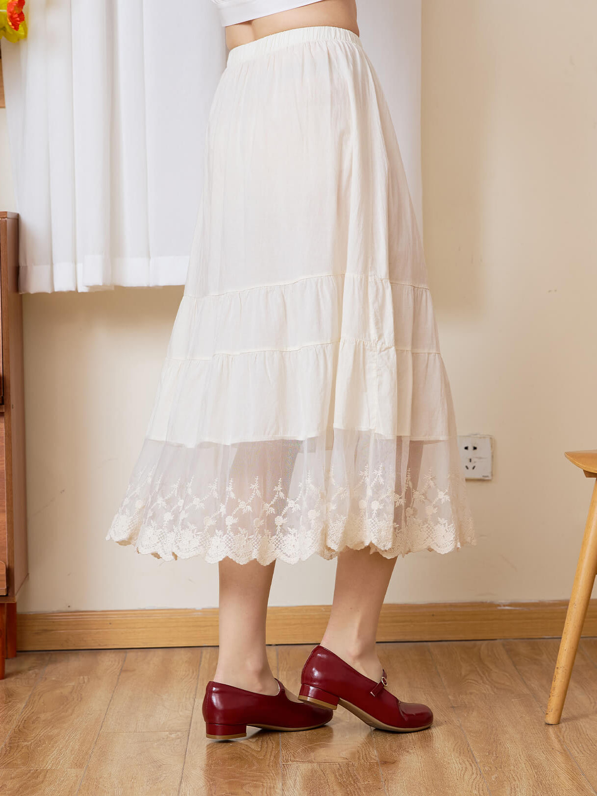 Sueasyretro cream cotton A-line skirt extender, side view showing the tiered lace hem in motion