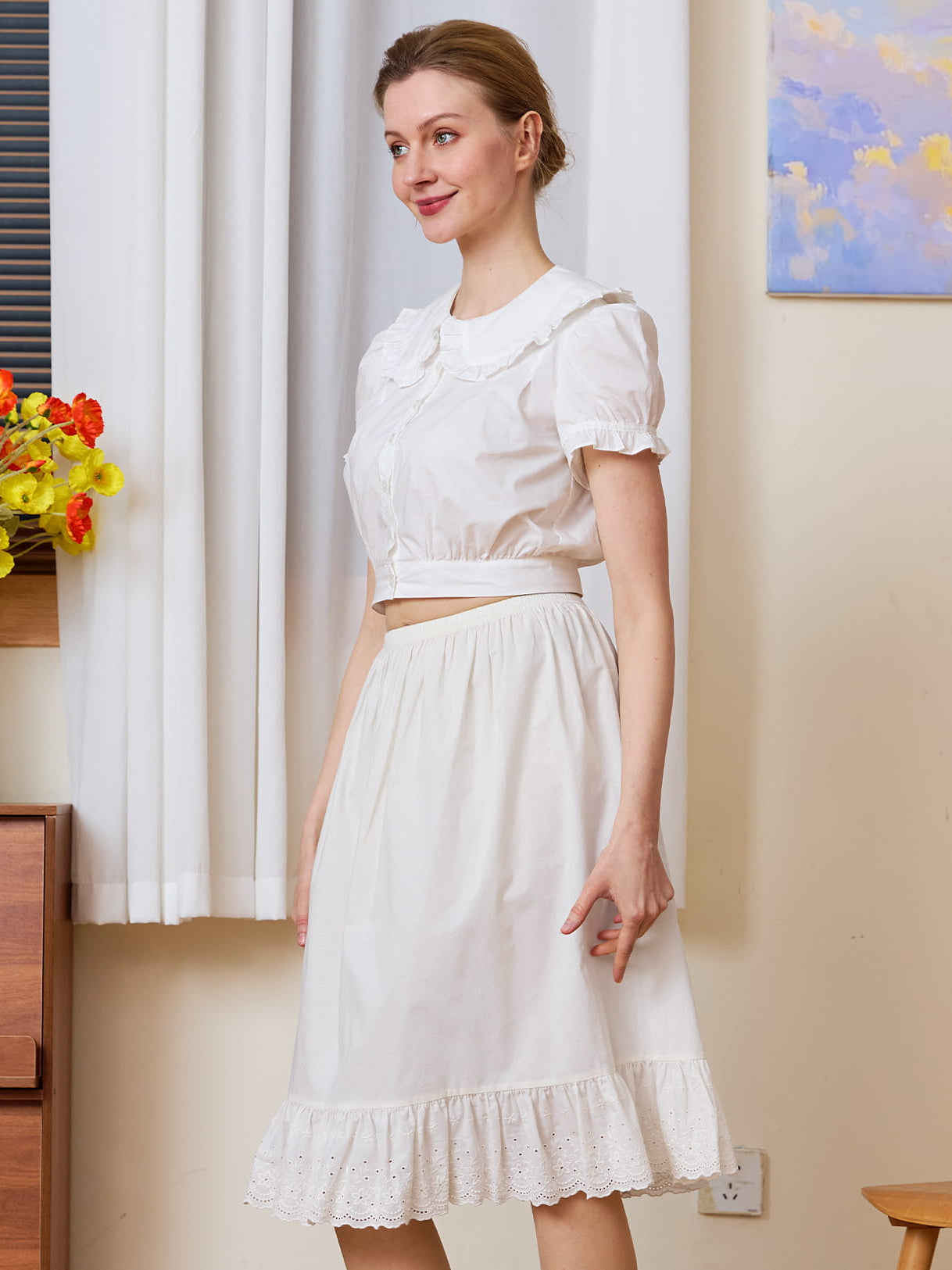 Elegant white cotton petticoat with nostalgic charm, featuring anti-cling fabric and delicate eyelet lace detailing.