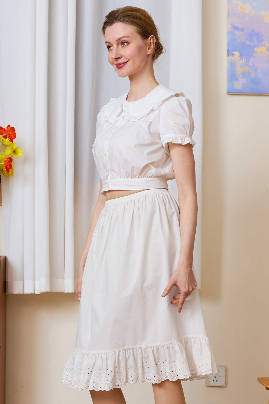 Elegant white cotton petticoat with nostalgic charm, featuring anti-cling fabric and delicate eyelet lace detailing.