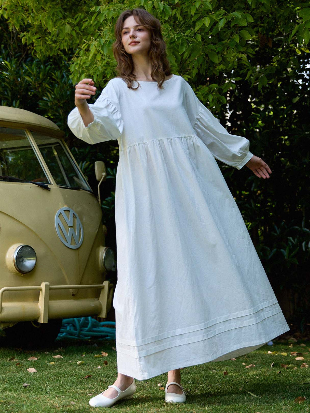 Plus size white cotton house dress by Sueasyretro in a garden.