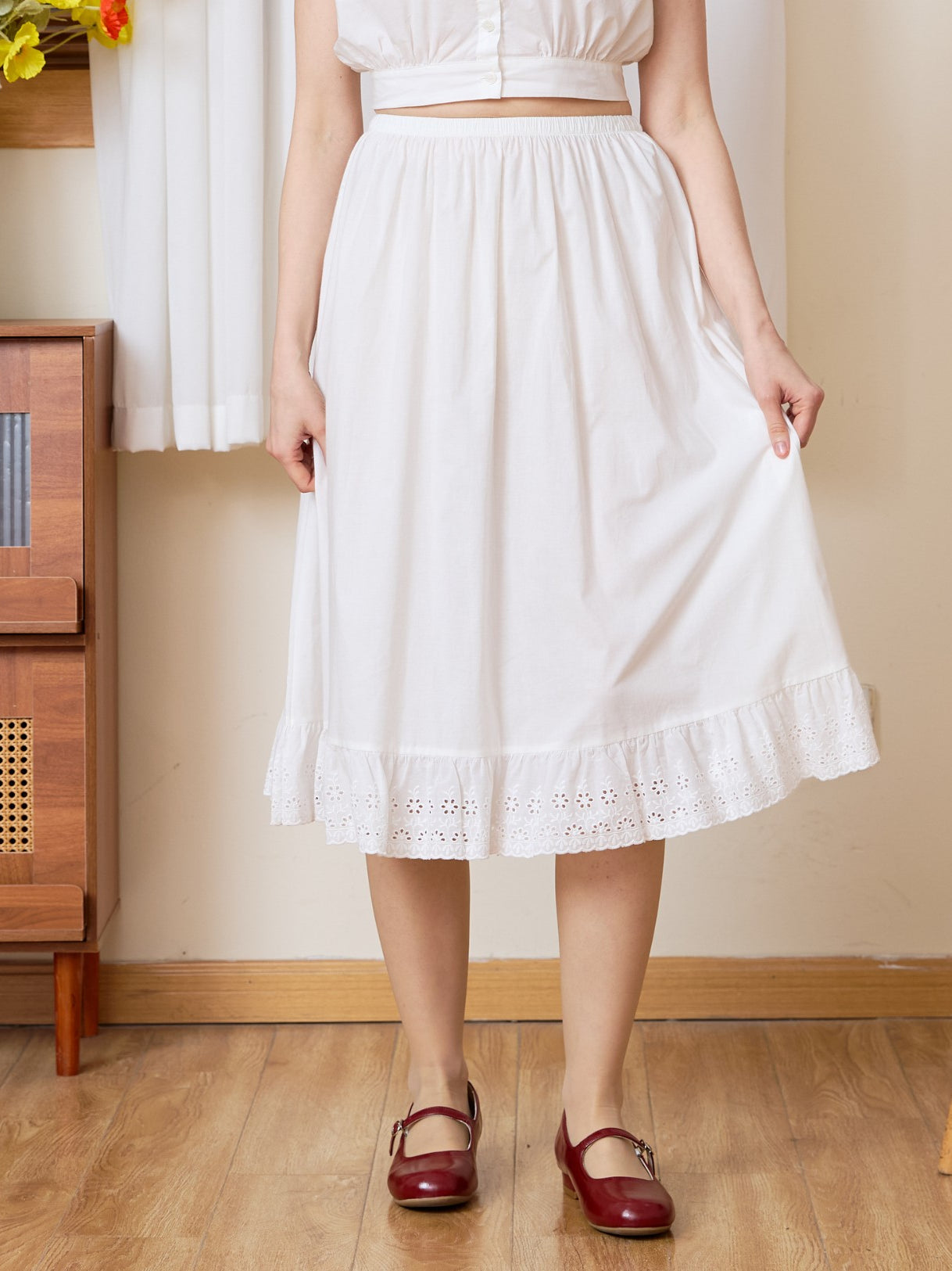 Front view of the Sueasyretro cotton Petticoat. A classic white half slip with a unique medallion lace edge.