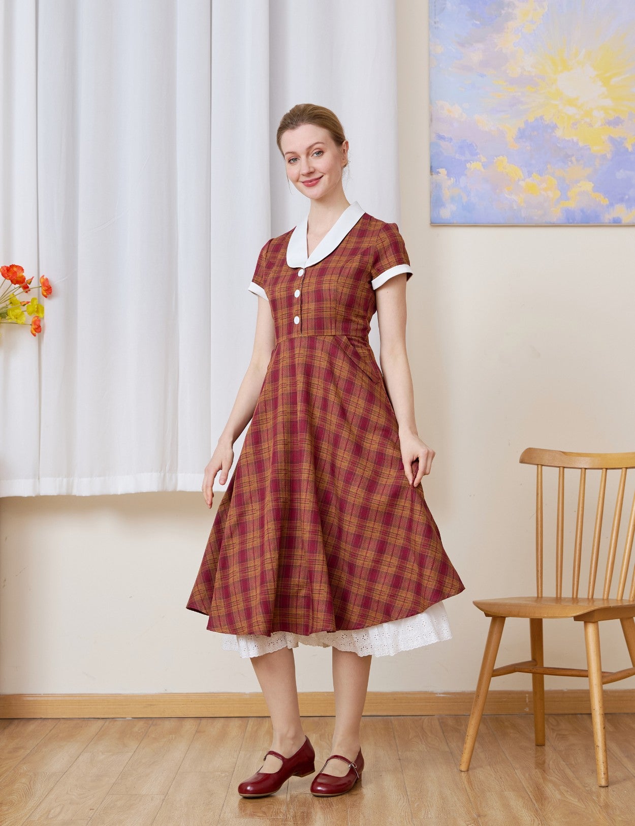 The long half slip layered under a red plaid dress. This cotton Petticoat adds vintage volume and lace detail.