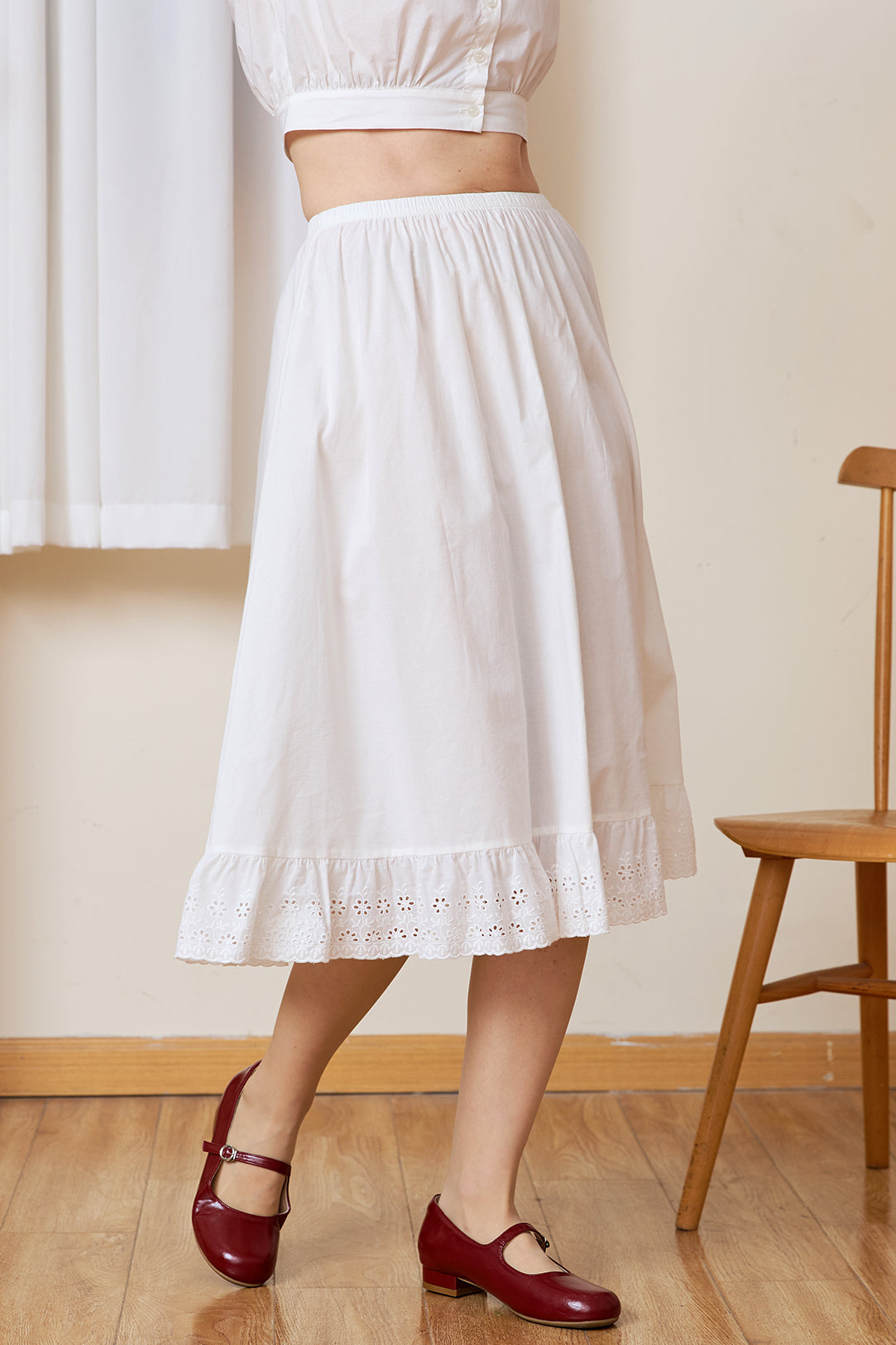 Side profile of the long half slip. A static-free cotton Petticoat with a geometric medallion lace edge.