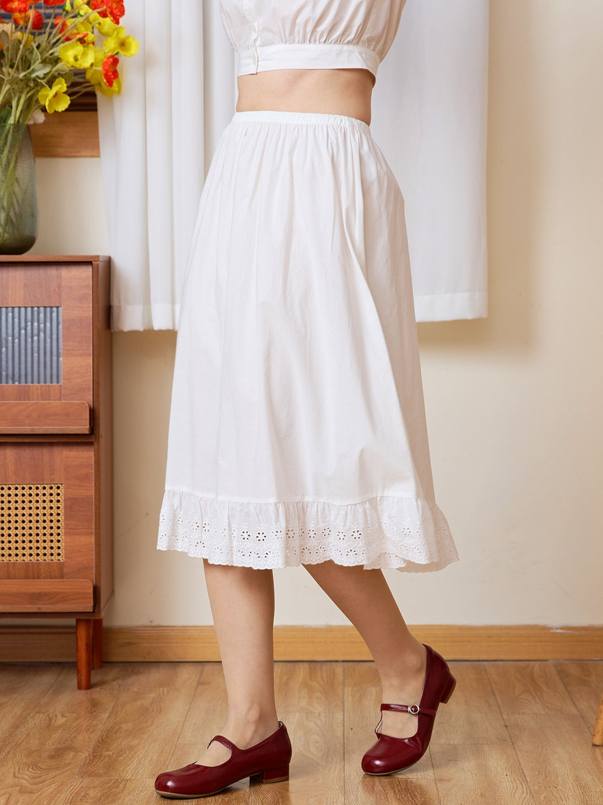 Side profile of the long half slip. A static-free cotton Petticoat with a geometric medallion lace edge.