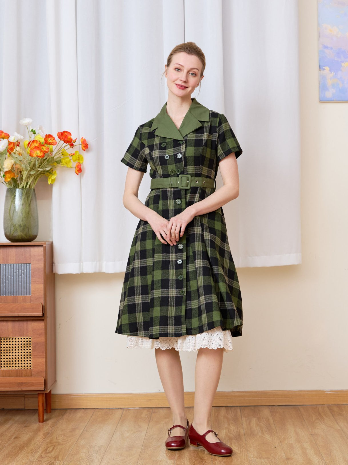 Cream cotton petticoat layered elegantly under a plaid dress, showcasing the classic English trellis lace hem peeking out.