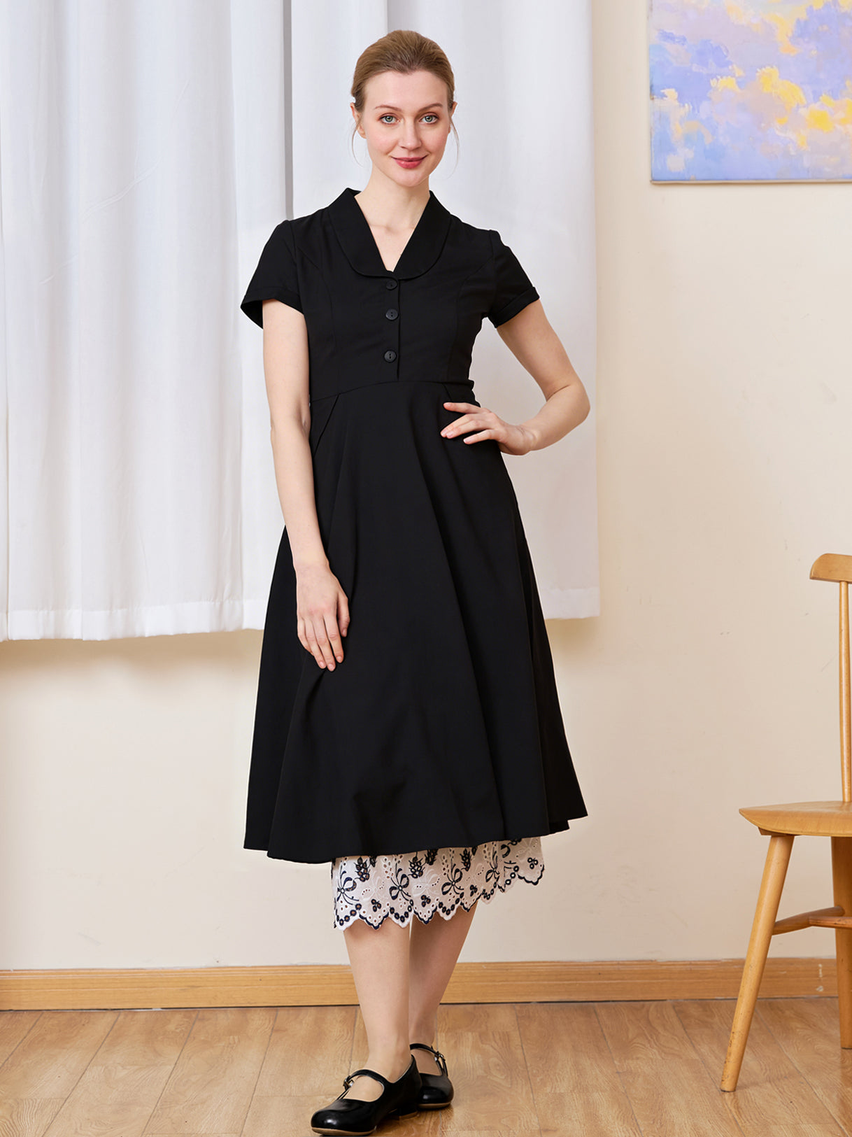 White cotton Petticoat with bluework hem layered perfectly under a solid black dress.