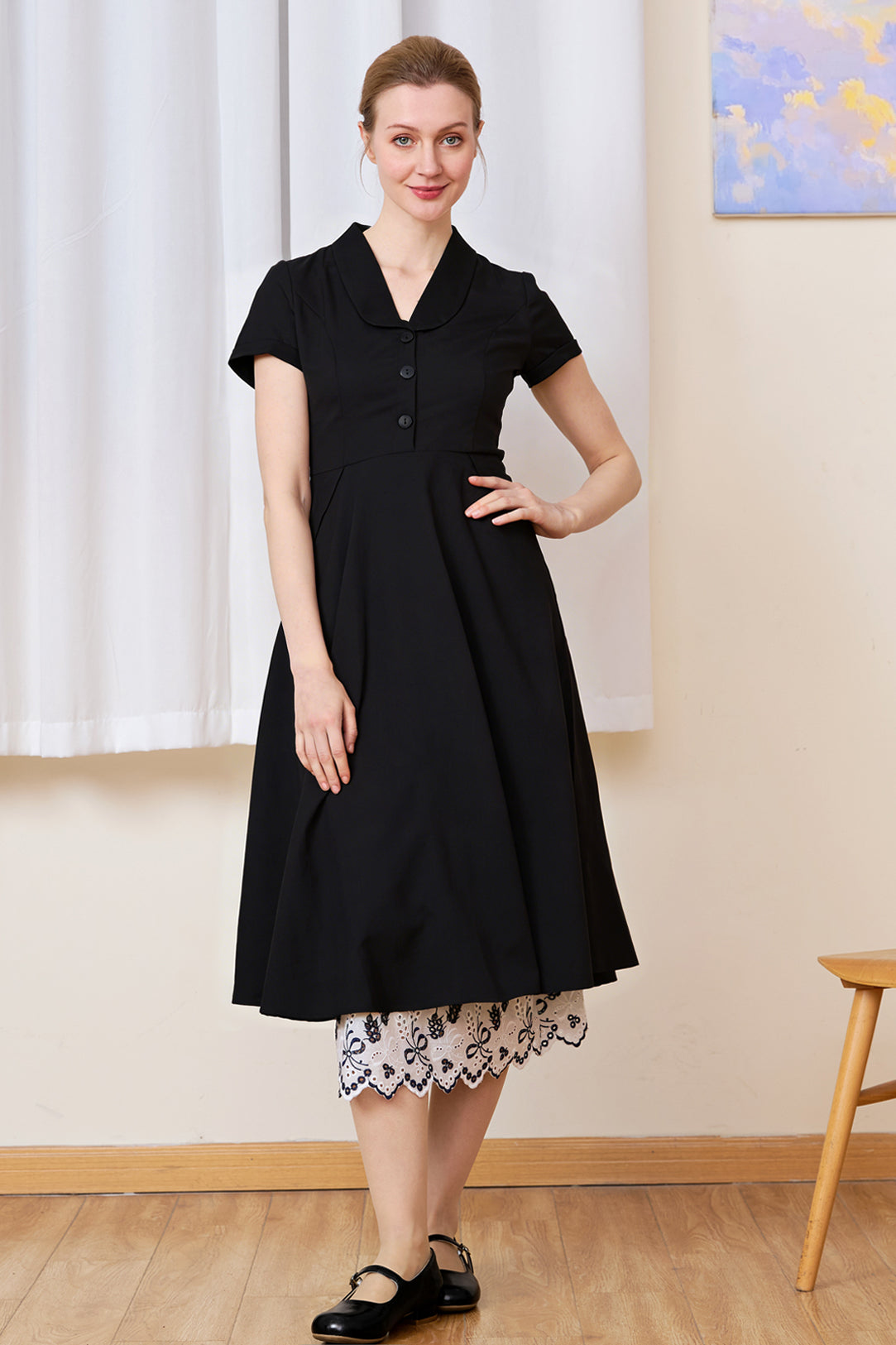 White cotton Petticoat with bluework hem layered perfectly under a solid black dress.