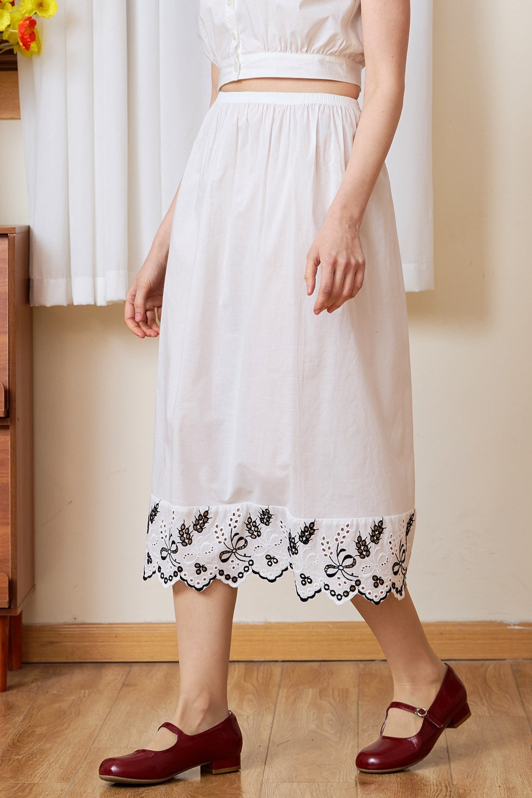 Waist-down view of the white cotton Petticoat, designed to feature Tudor bluework.