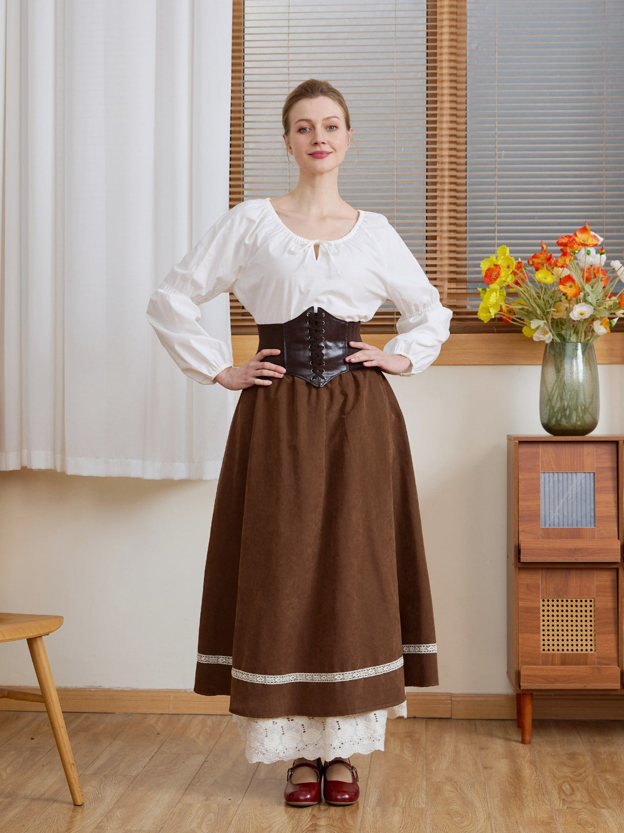 The Ivory Renaissance Cotton Blouse styled with a dark brown corset and long skirt for a medieval pirate outfit.