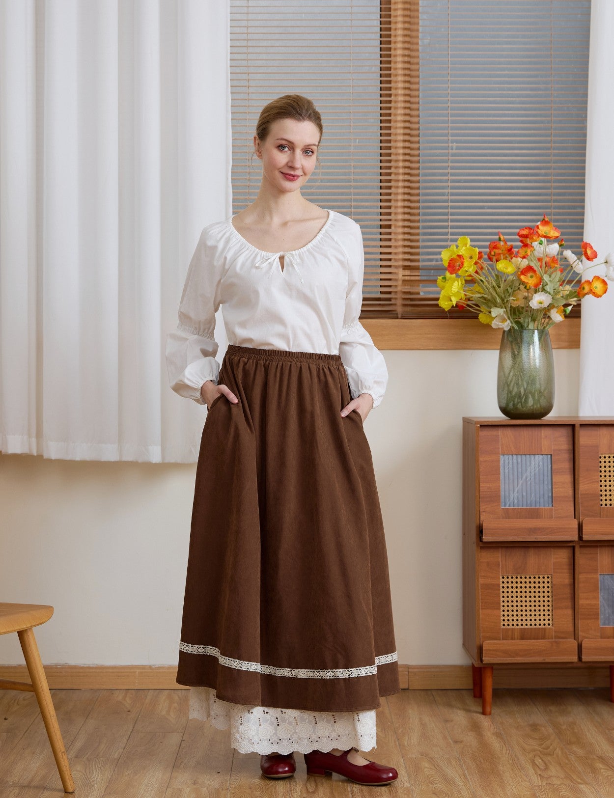 Full outfit showing the Ivory Renaissance Cotton Blouse tucked into a brown skirt for a vintage-inspired look.