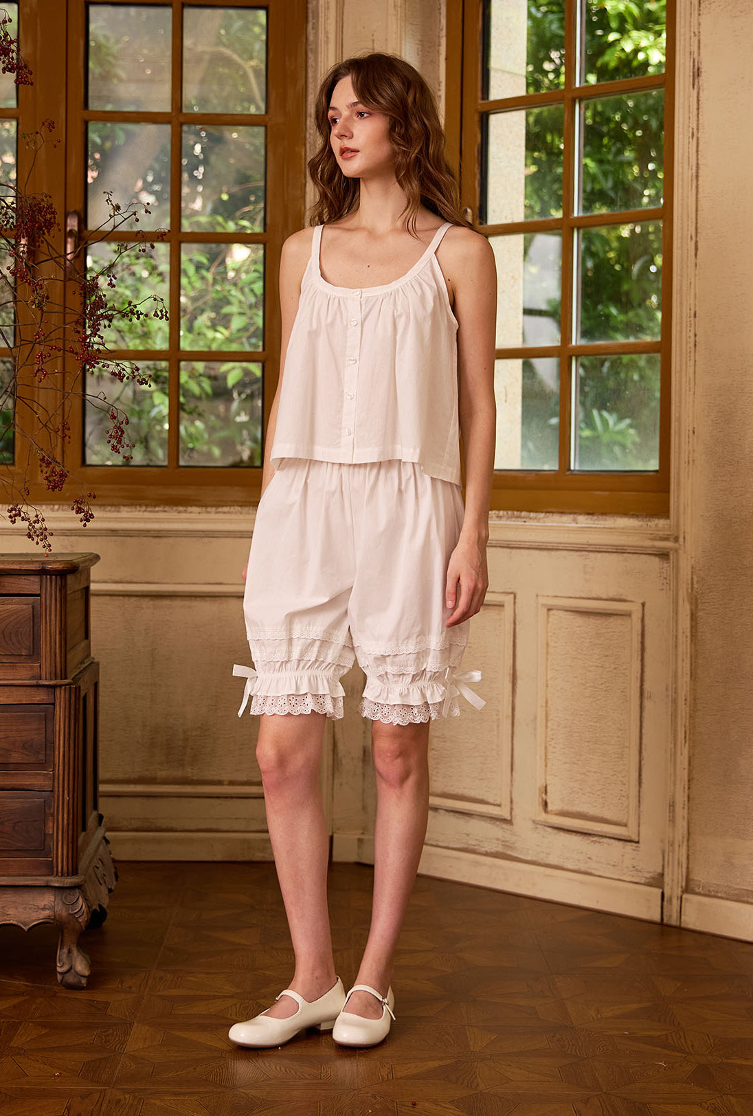 Vintage style cotton bloomers for women in ivory, in a retro style room.