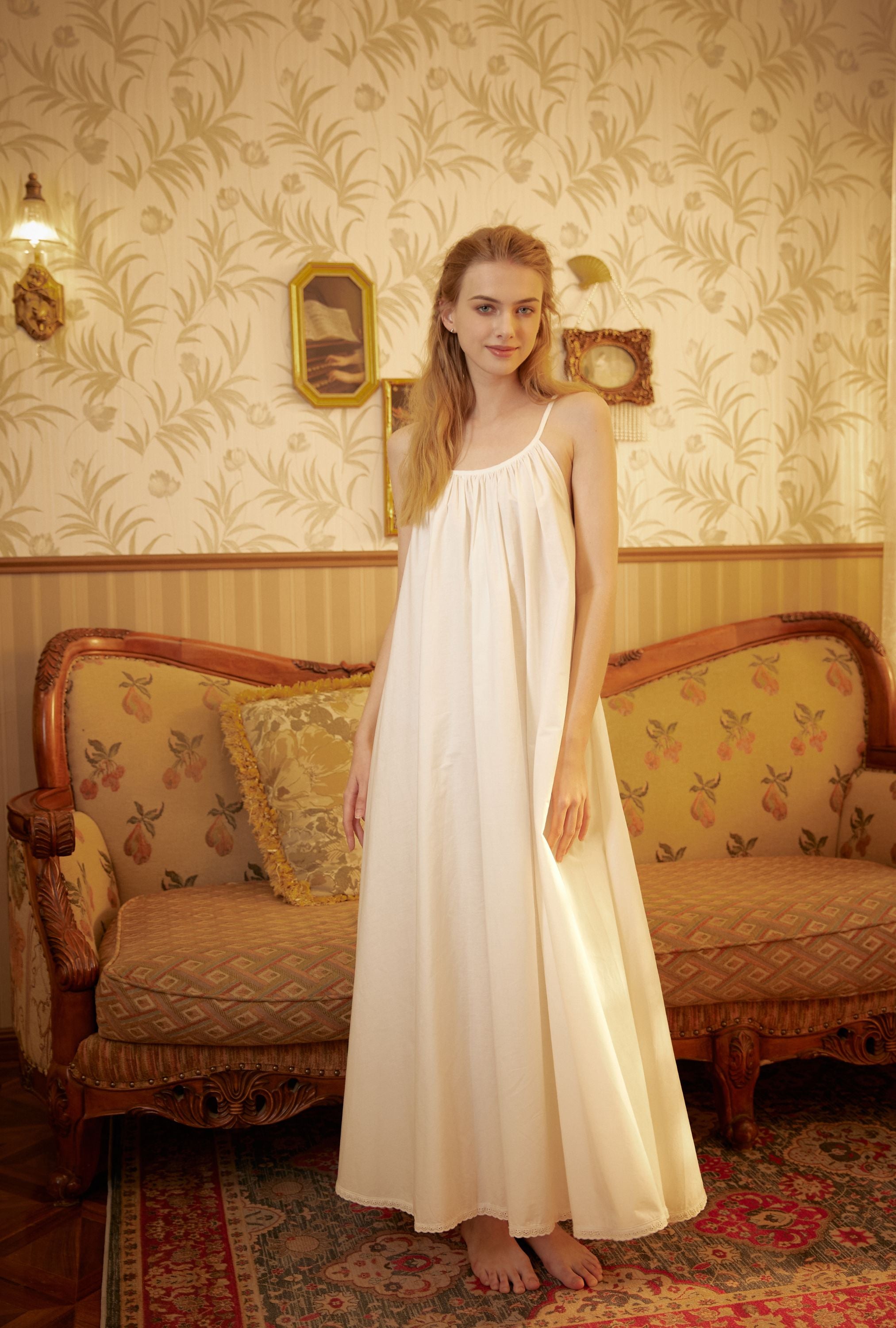 Full-length 100% cotton Victorian women's nightgown with spaghetti straps in a vintage interior setting.