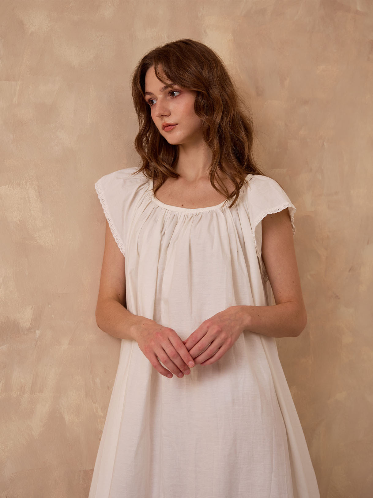 Sueasyretro ivory Victorian nightgown. Close-up of sleeveless cotton modest nightie featuring exquisite eyelet lace trim.