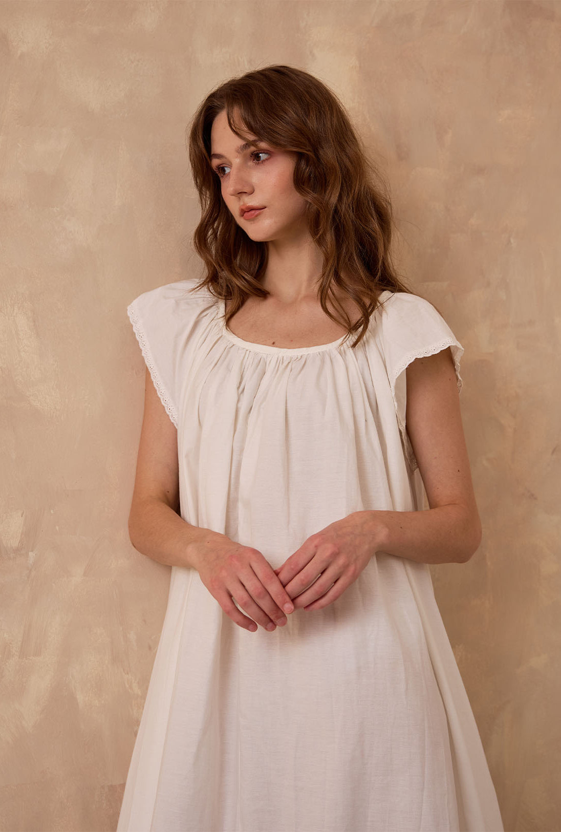 Sueasyretro ivory Victorian nightgown. Close-up of sleeveless cotton modest nightie featuring exquisite eyelet lace trim.