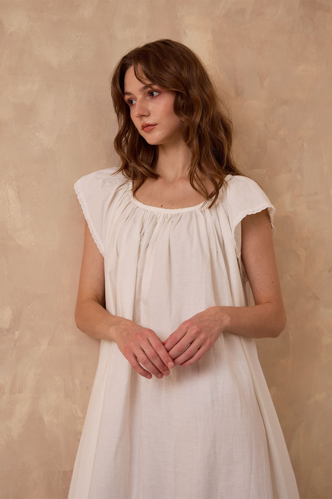 Sueasyretro ivory Victorian nightgown. Close-up of sleeveless cotton modest nightie featuring exquisite eyelet lace trim.
