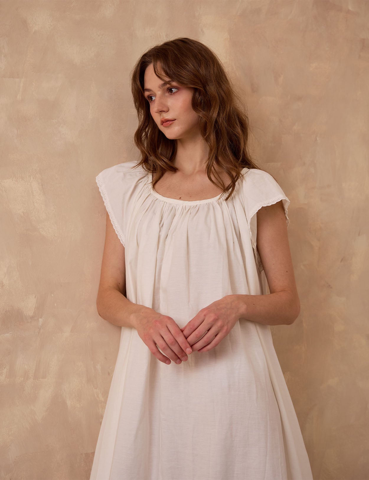 Sueasyretro ivory Victorian nightgown. Close-up of sleeveless cotton modest nightie featuring exquisite eyelet lace trim.