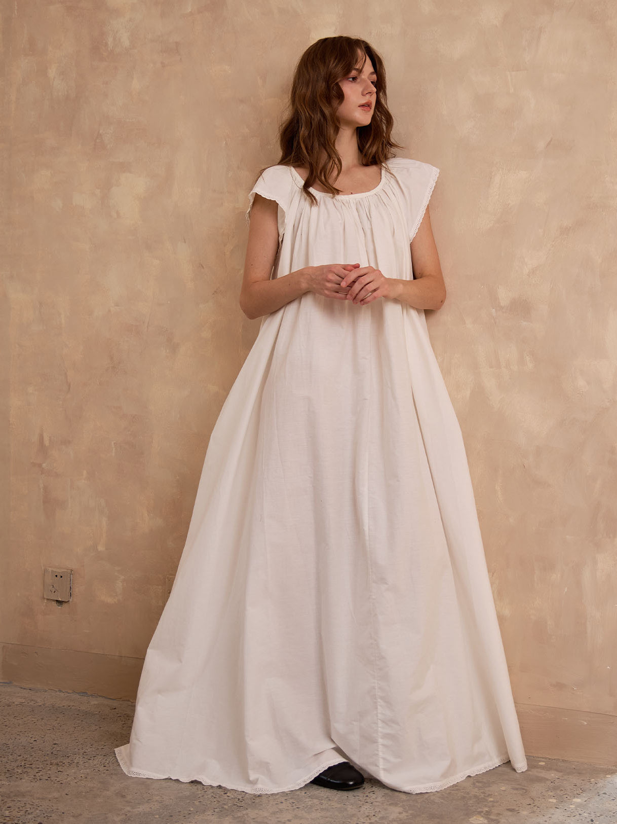 Full length view of Sueasyretro ivory Victorian nightgown. A roomy, voluminous cotton nightie with romantic lace hem.