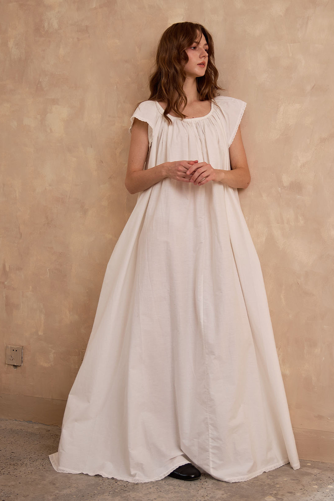 Full length view of Sueasyretro ivory Victorian nightgown. A roomy, voluminous cotton nightie with romantic lace hem.