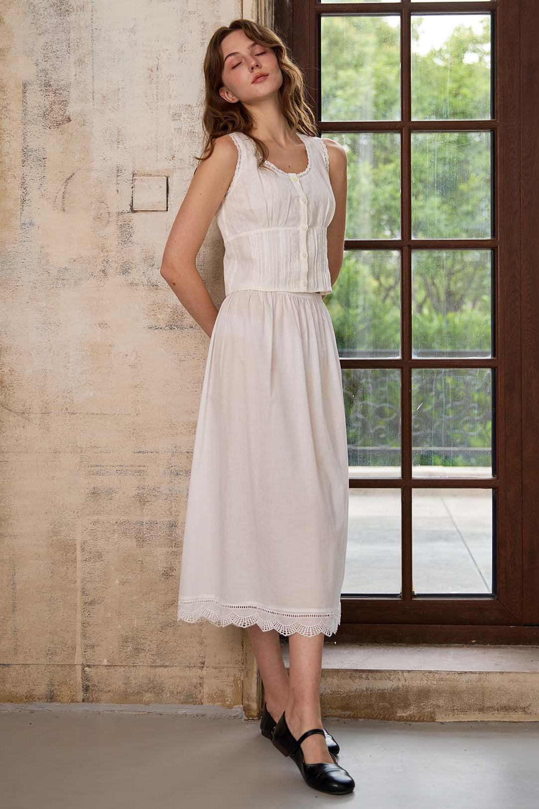 Woman wearing the Sueasyretro ivory petticoat as a light midi length skirt. Vintage lace trim underskirt styling.