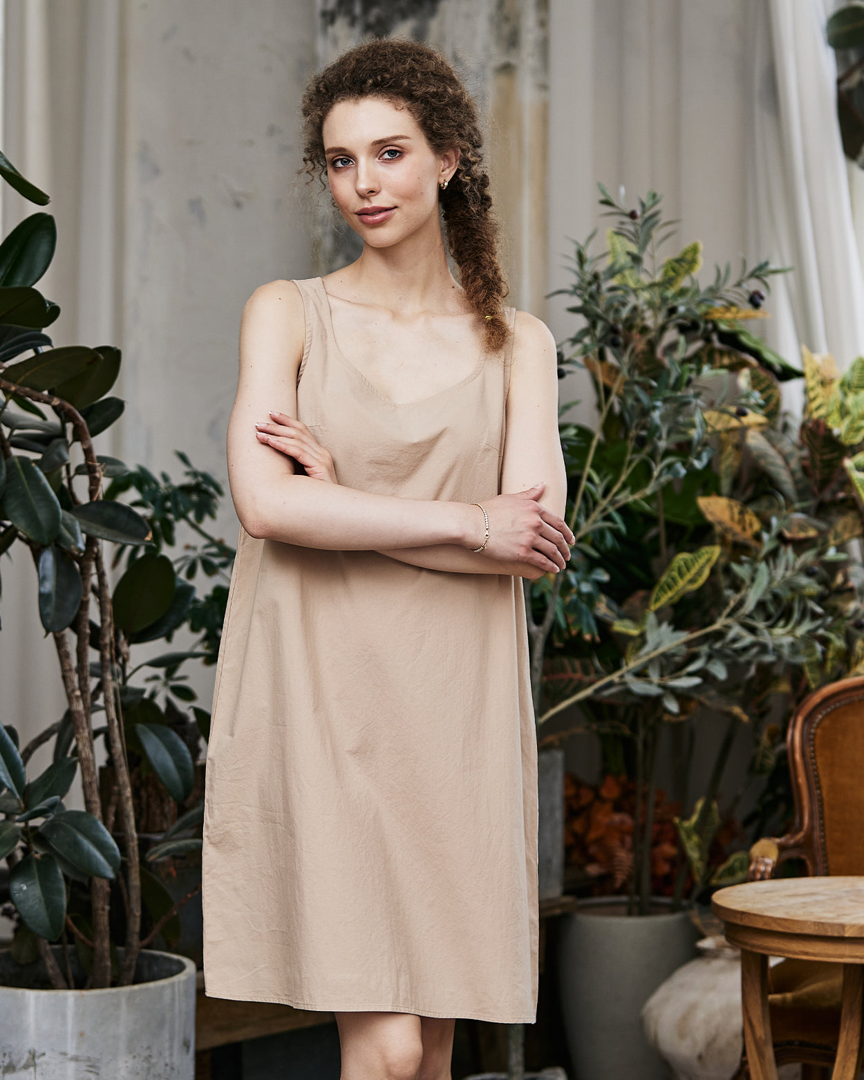 Women's nude cotton full slip with wide straps, front view showing modesty panel and knee-length design