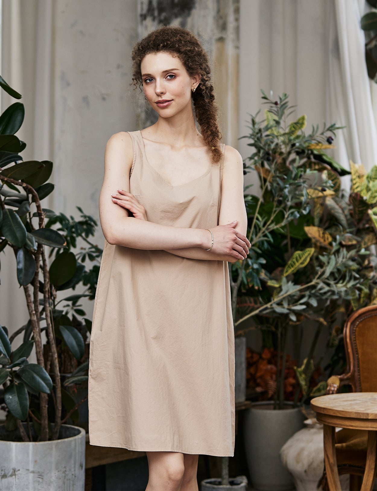 Women's nude cotton full slip with wide straps, front view showing modesty panel and knee-length design