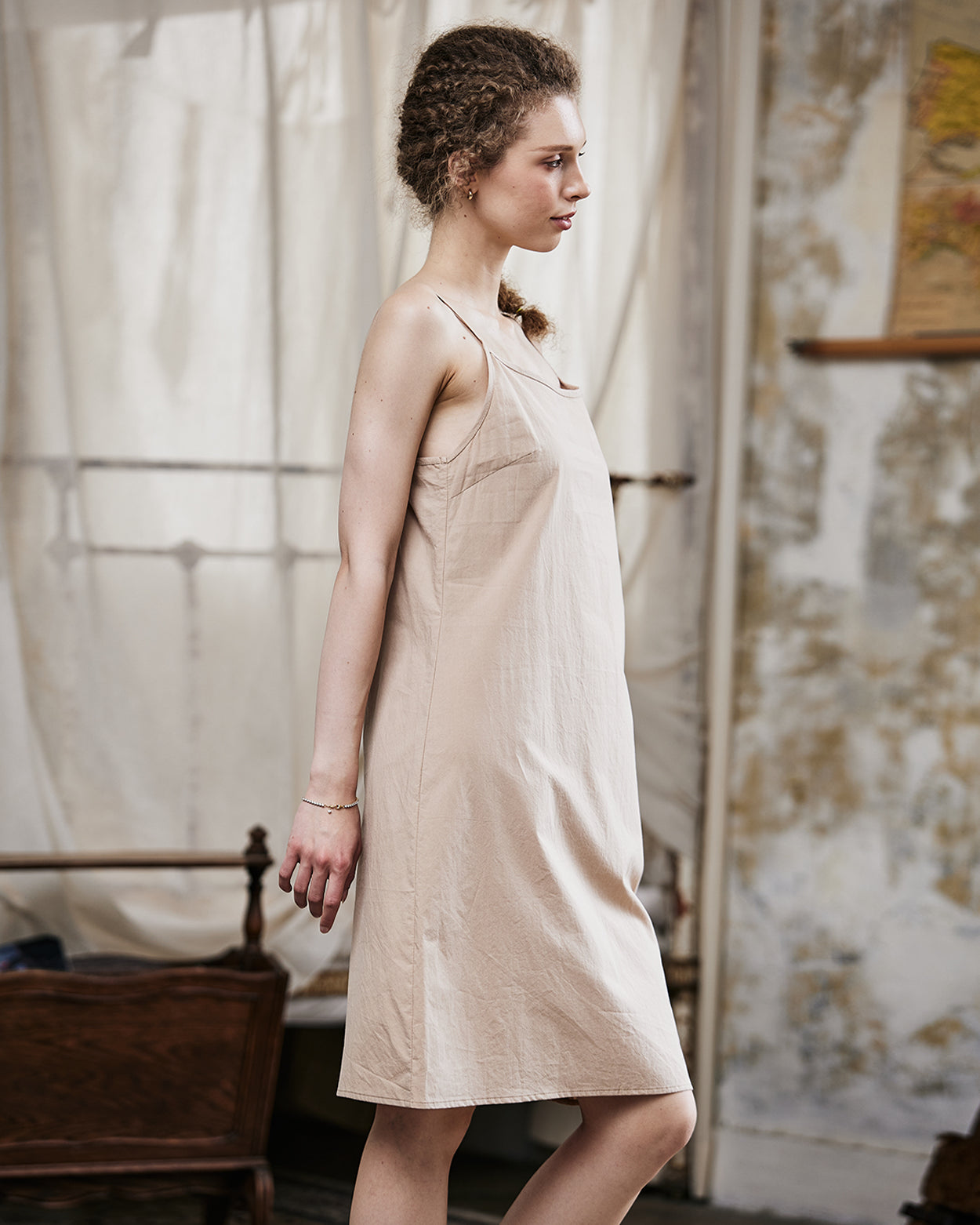 Women's nude cotton full slip with spaghetti straps, showing comfortable fit and classic design - side view