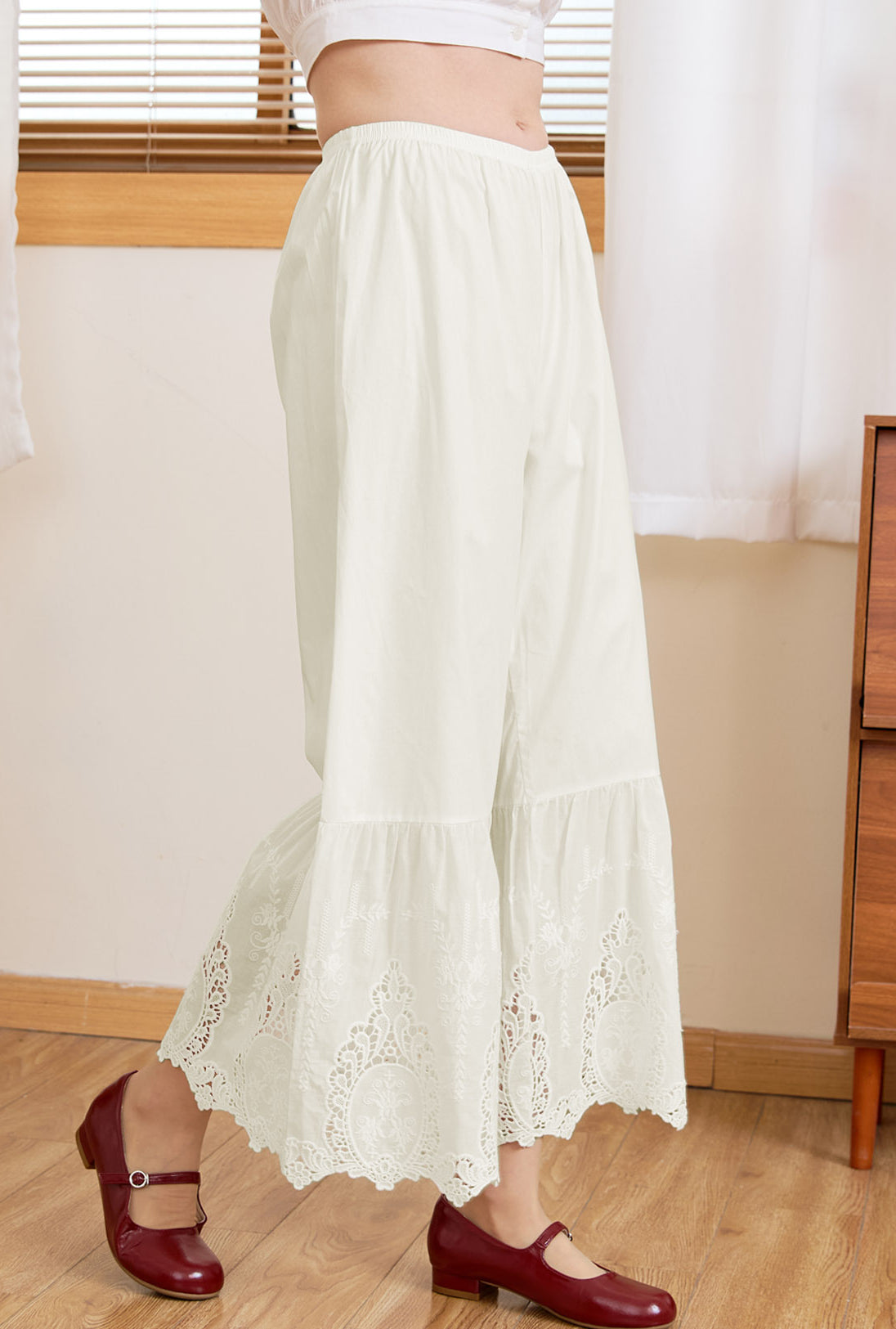 Close-up of intricate Broderie Anglaise mirror motif lace on Sueasyretro cream cotton bloomers.