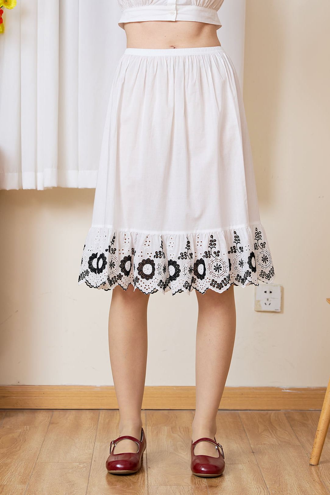 Sueasyretro Vintage Ivory Half Slip: close-up of 100% cotton fabric and dramatic black floral embroidered ruffle hem.