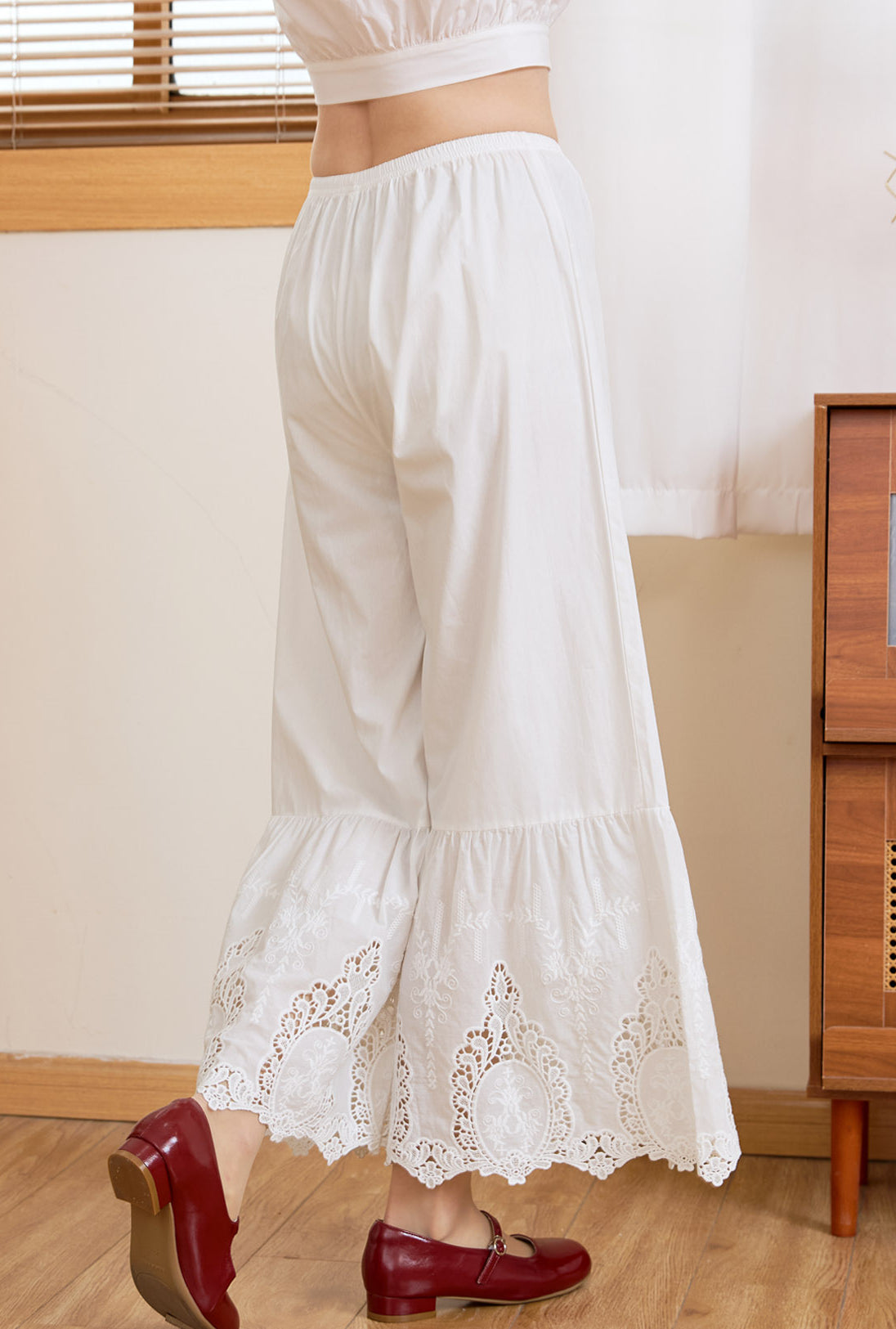 Back view of Ivory Sueasyretro vintage bloomer pants with elastic waist and delicate lace detail.