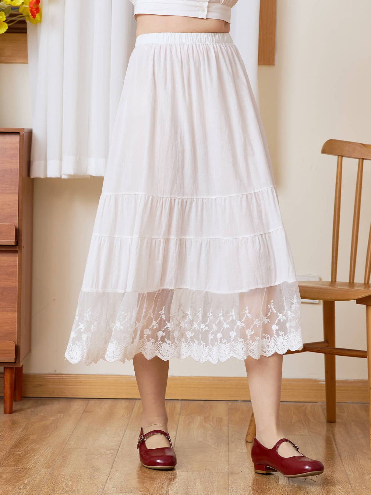 Front view of Sueasyretro white cotton A-line skirt extender featuring a beautiful tiered lace hem.