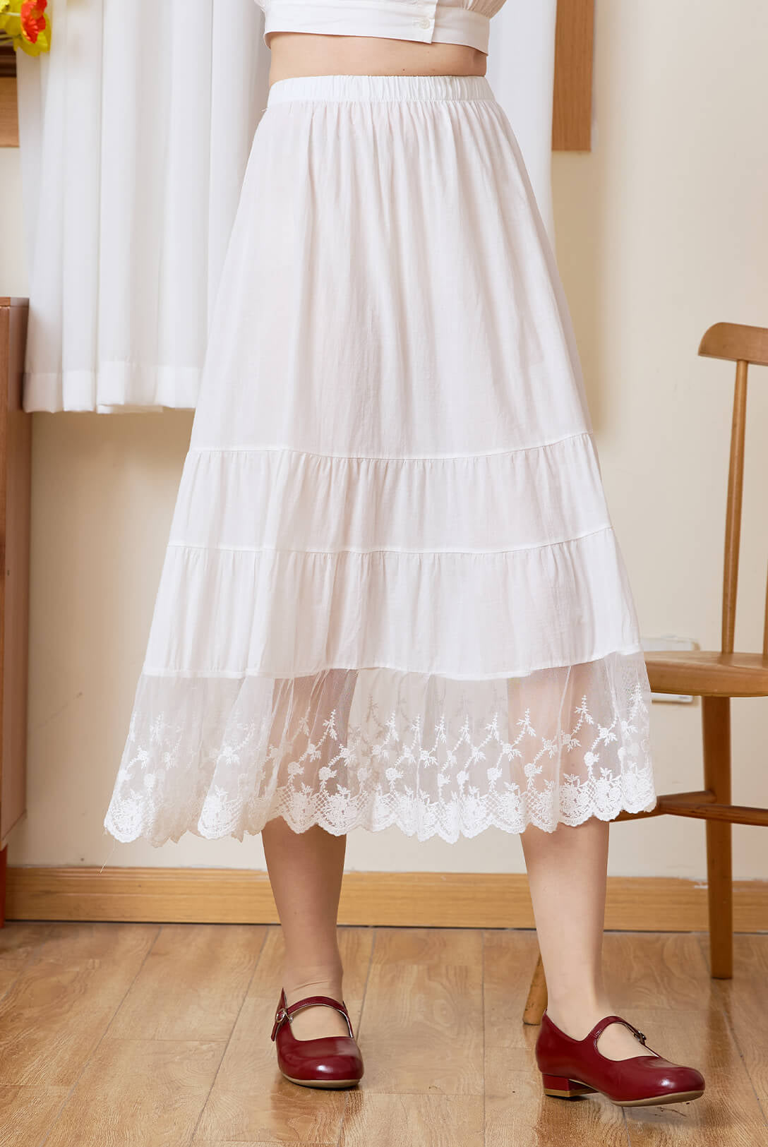 Front view of Sueasyretro white cotton A-line skirt extender featuring a beautiful tiered lace hem.