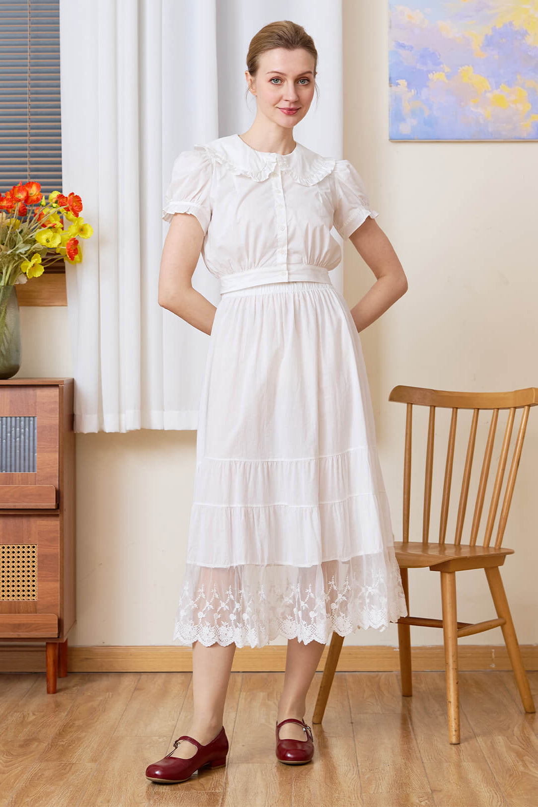 Model wearing the versatile Sueasyretro white cotton A-line skirt slip with tiered lace hem.