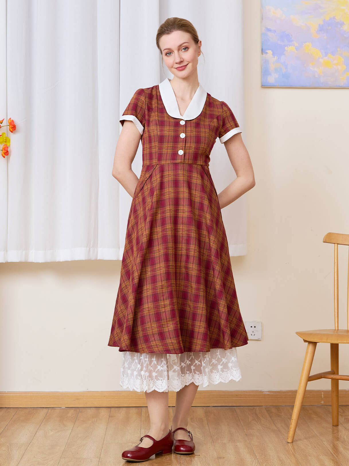 Sueasyretro cotton A-line skirt extender with tiered lace layered under a red plaid midi dress.