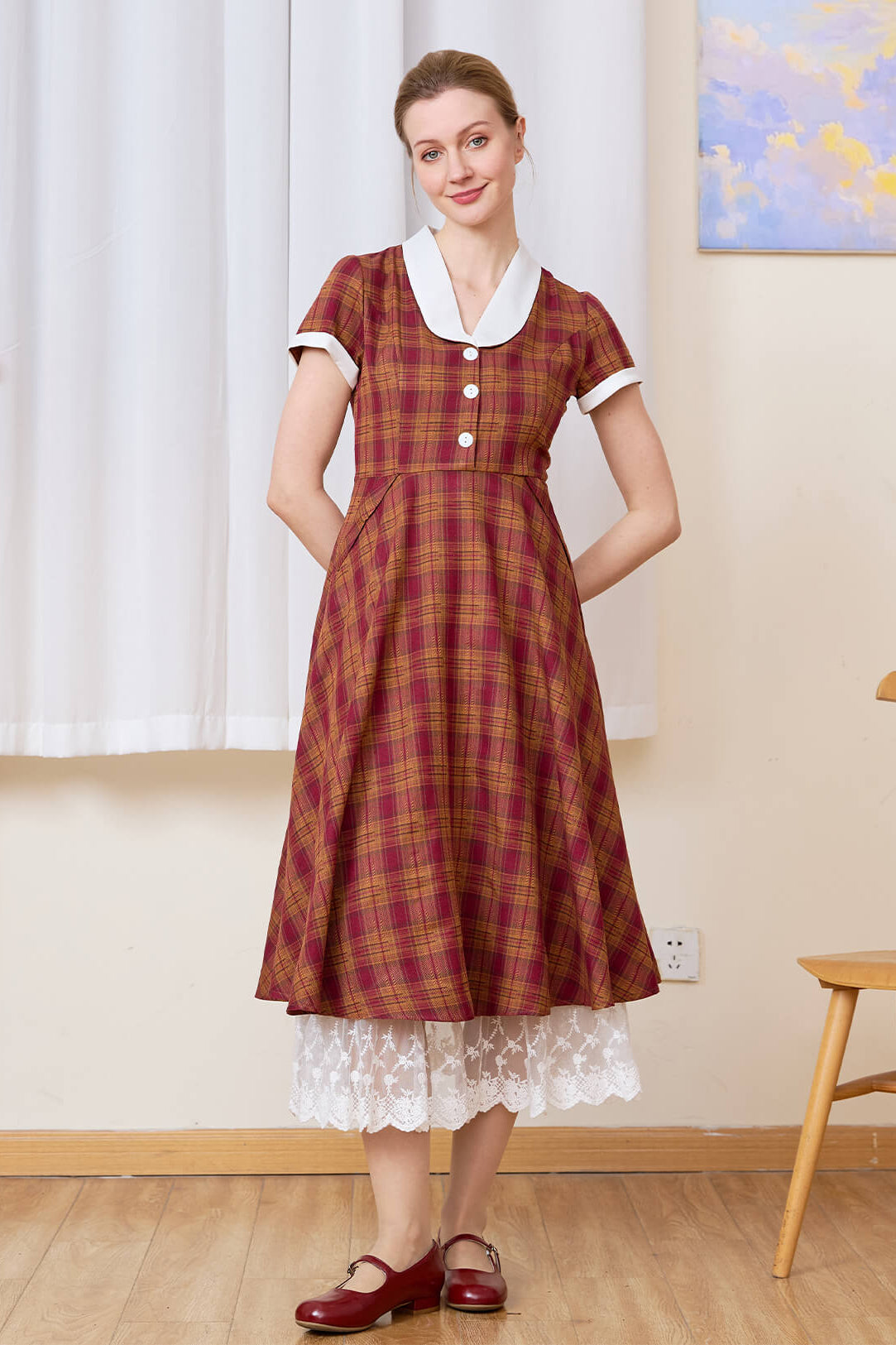 Sueasyretro cotton A-line skirt extender with tiered lace layered under a red plaid midi dress.