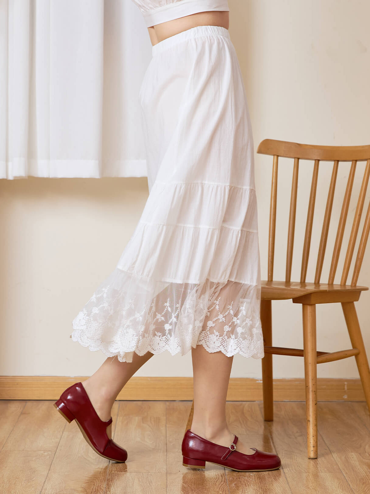 Side view of Sueasyretro A-line skirt extender showing the beautiful drape of the tiered lace hem.