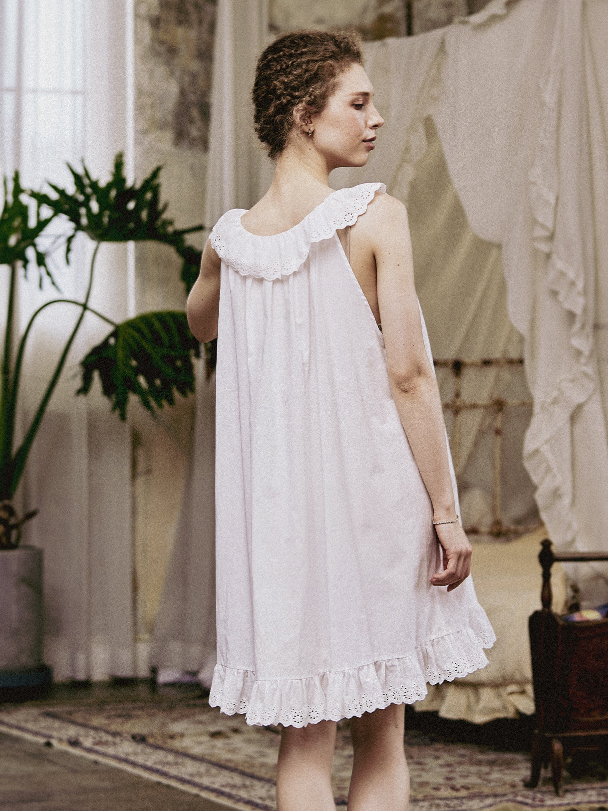 Back view of the Victorian-style nightgown showing the elegant scoop back and ruffled lace collar.
