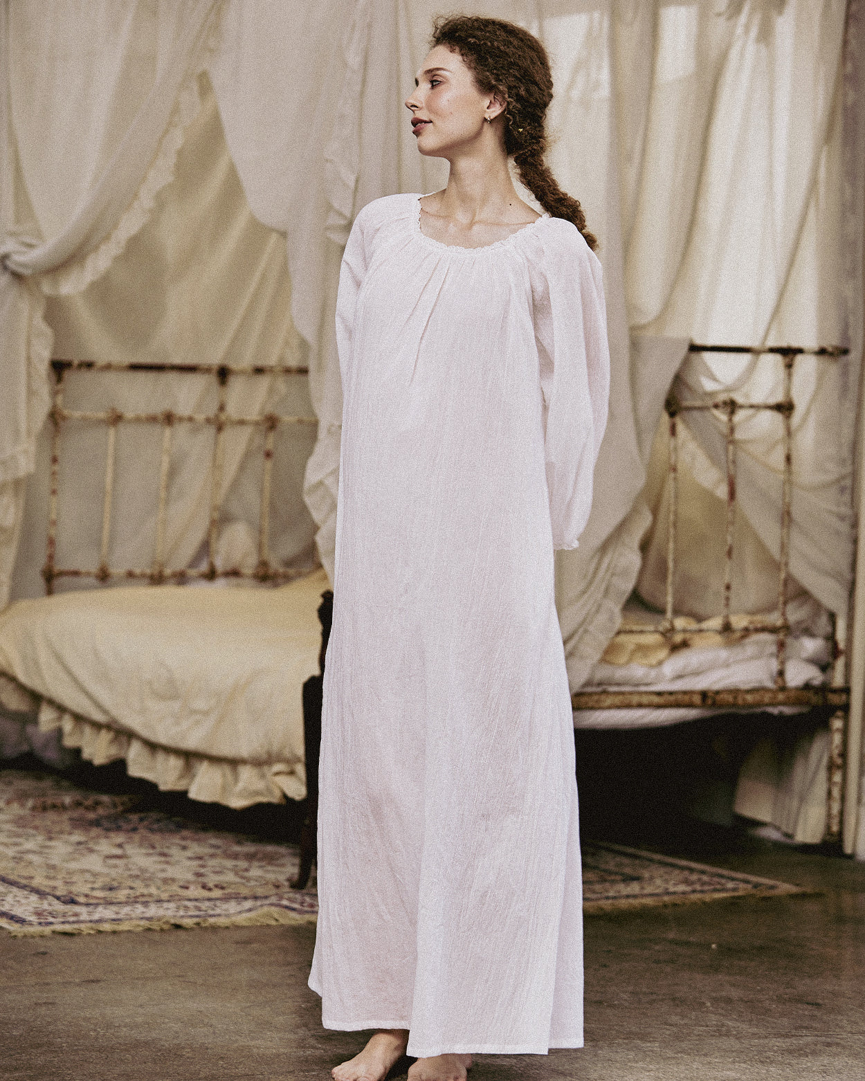 White Victorian nightgown for women with long sleeves and elegant lace trim