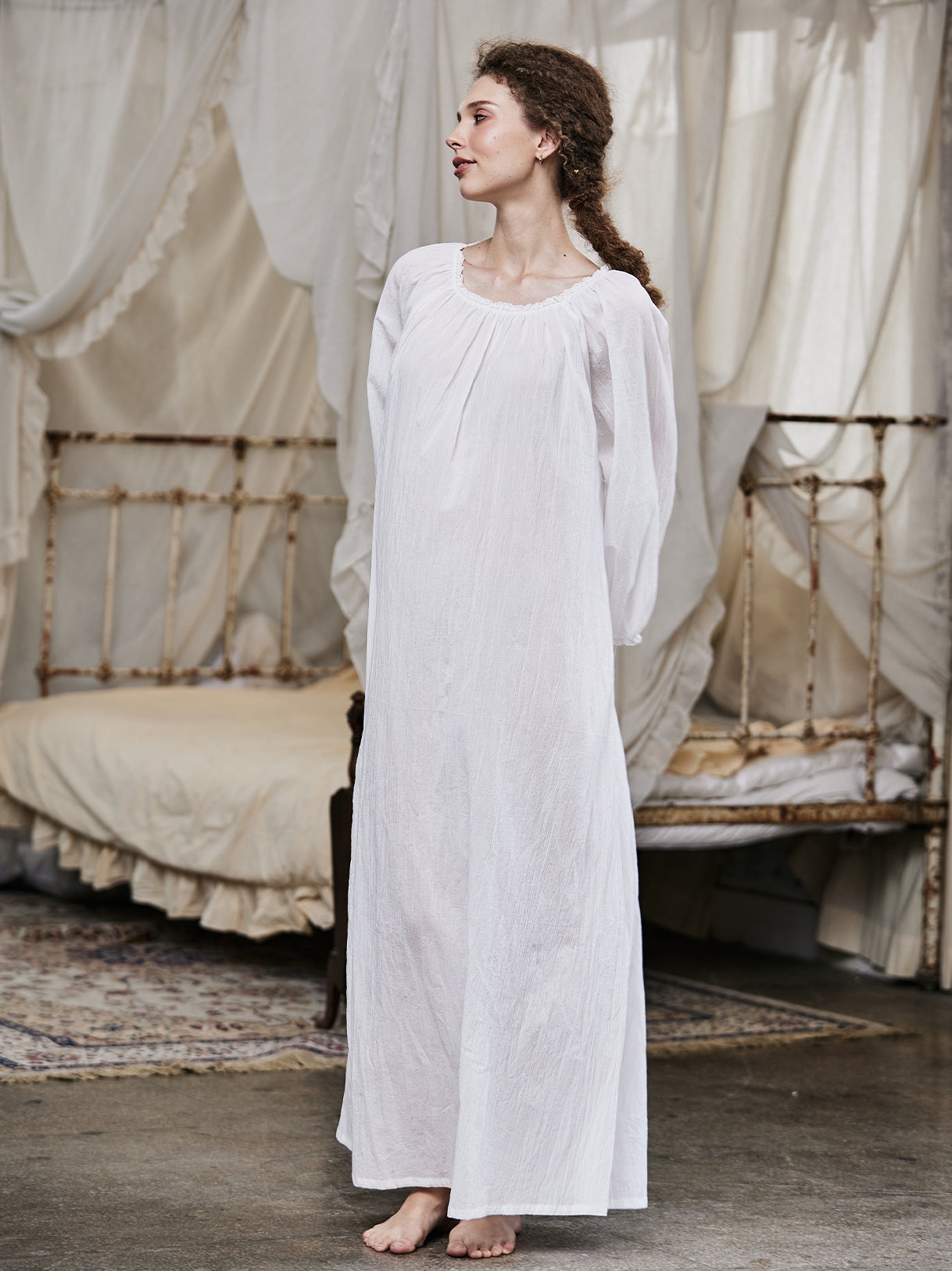 White Victorian nightgown for women with long sleeves and elegant lace trim