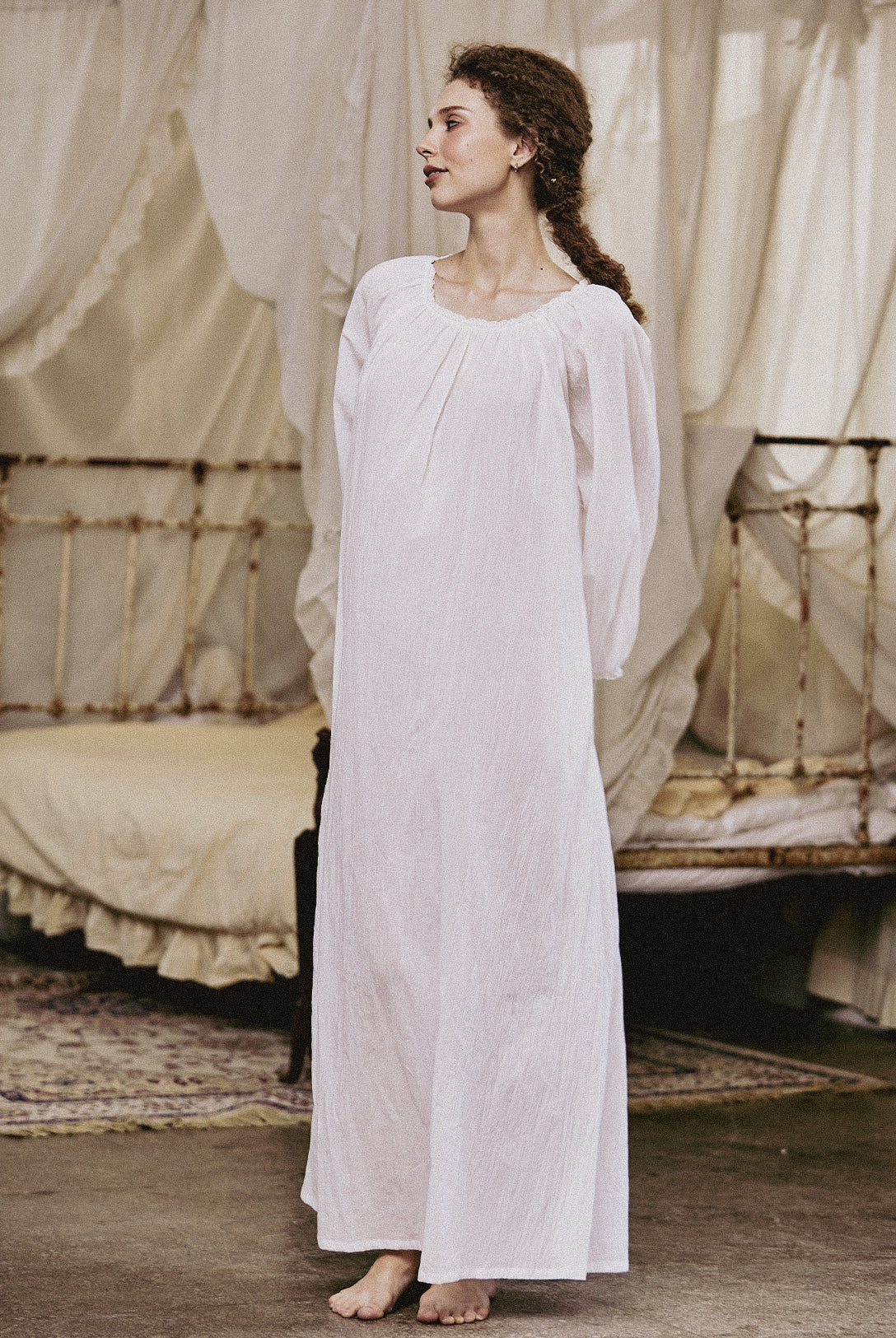 White Victorian nightgown for women with long sleeves and elegant lace trim
