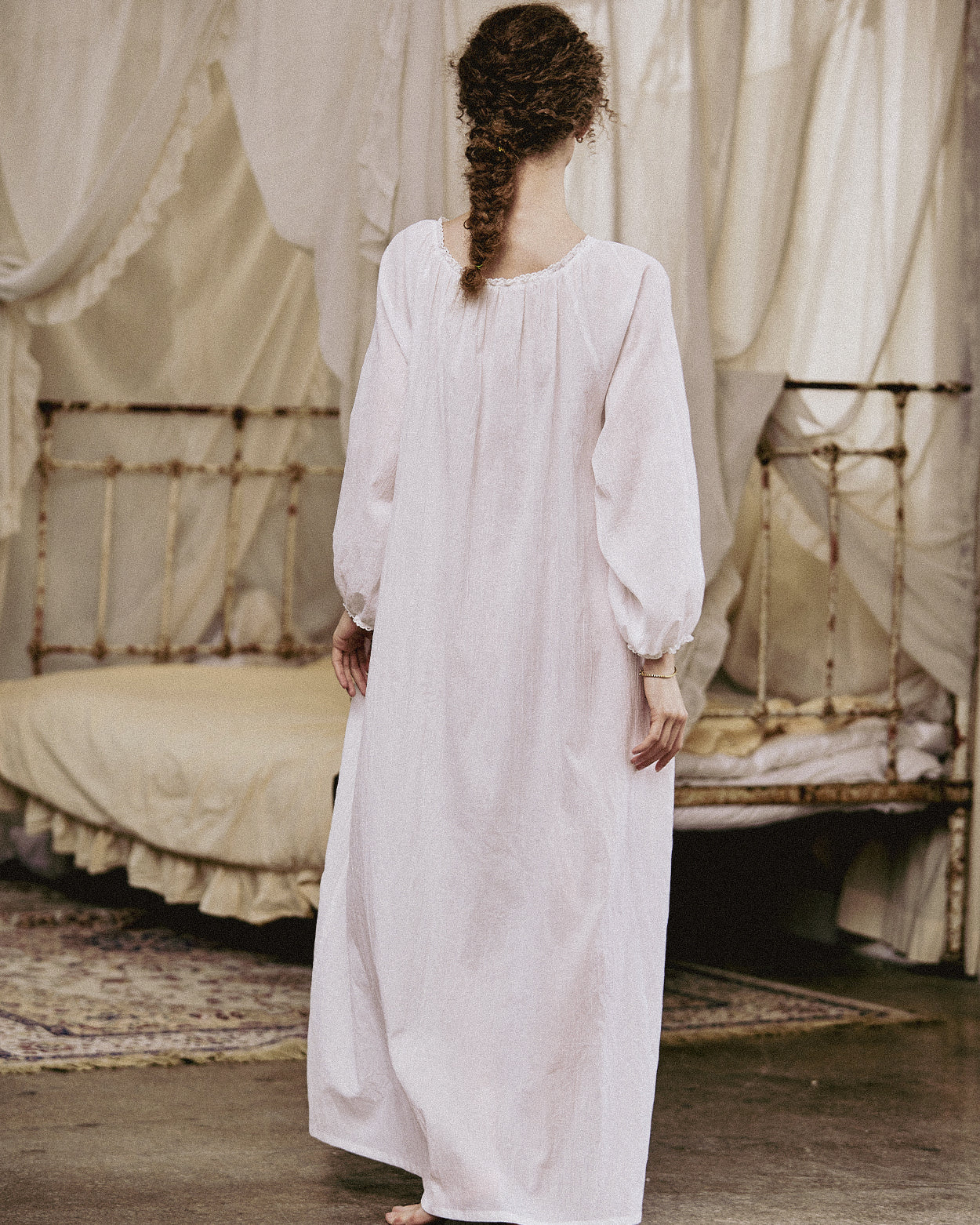 White Victorian nightgown for women with long sleeves and elegant lace trim