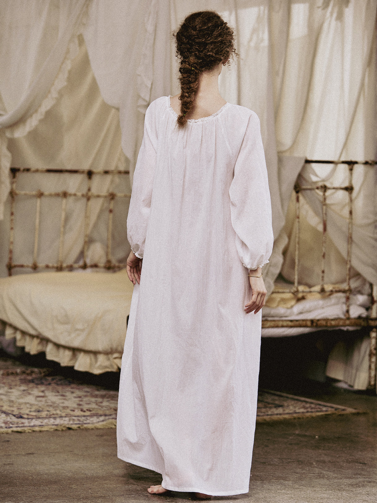 White Victorian nightgown for women with long sleeves and elegant lace trim