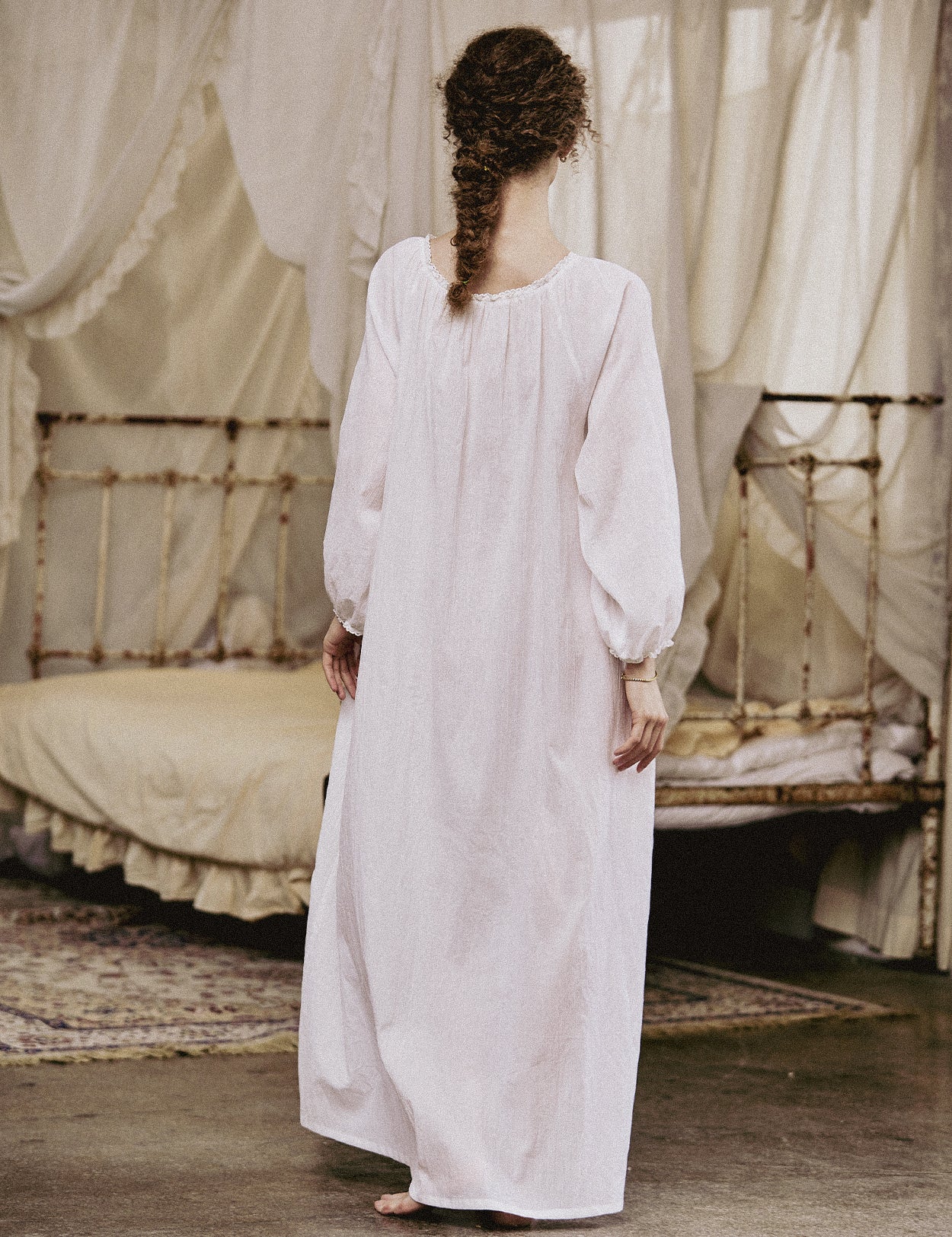 White Victorian nightgown for women with long sleeves and elegant lace trim