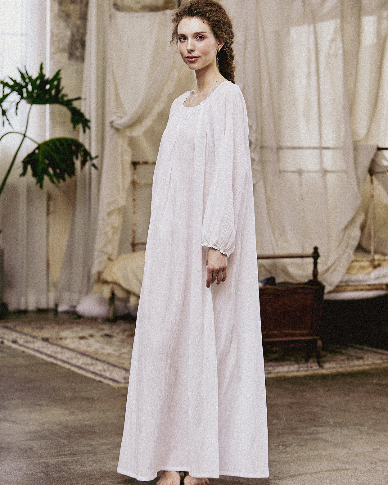 White Victorian nightgown for women with long sleeves and elegant lace trim