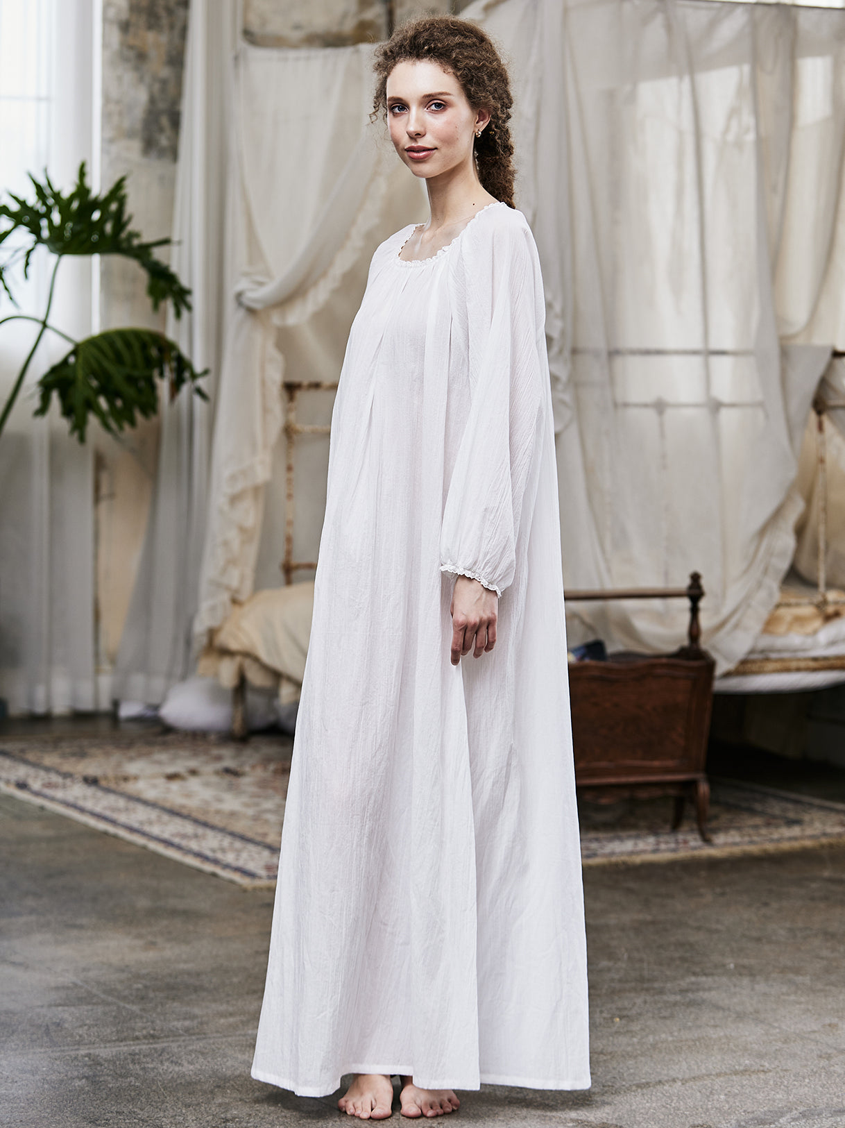 White Victorian nightgown for women with long sleeves and elegant lace trim