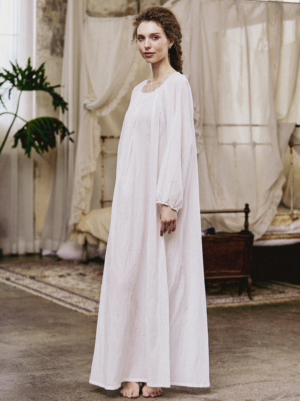 White Victorian nightgown for women with long sleeves and elegant lace trim