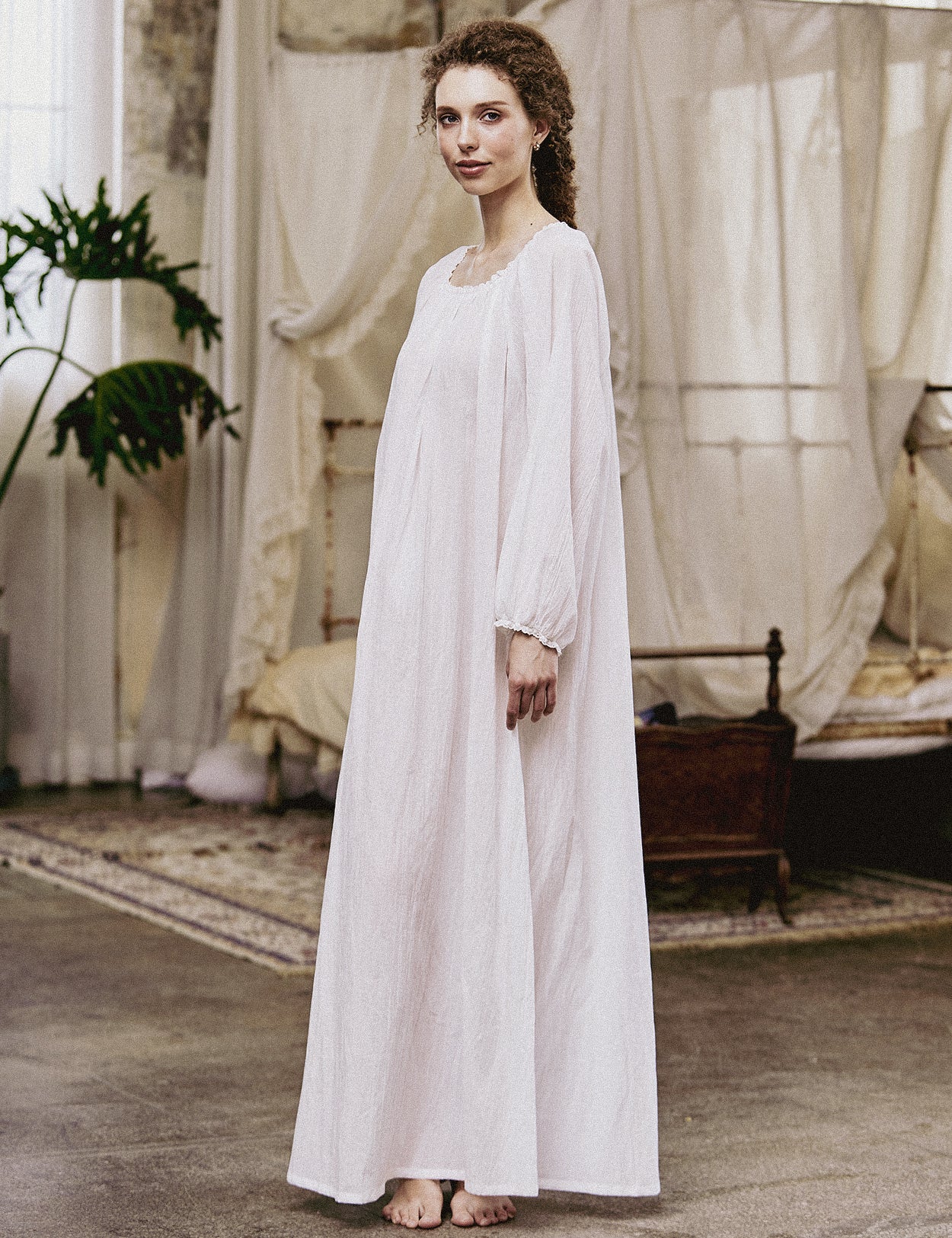 White Victorian nightgown for women with long sleeves and elegant lace trim