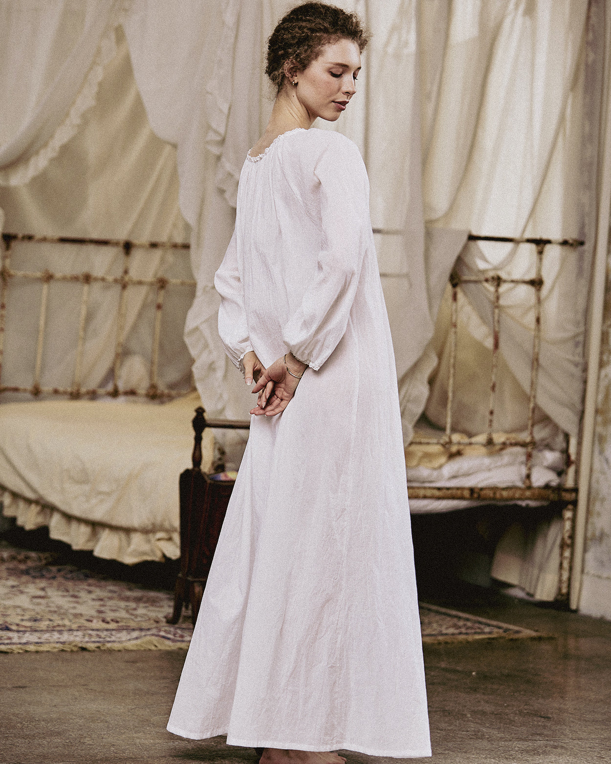 White Victorian nightgown for women with long sleeves and elegant lace trim