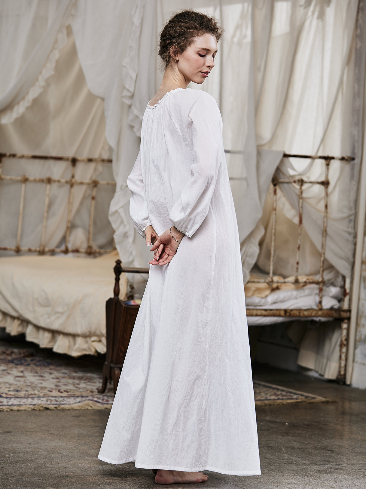 White Victorian nightgown for women with long sleeves and elegant lace trim